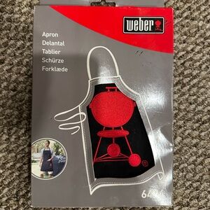 NIB Web Grill Apron! Perfect for any barbecue enthusiast.